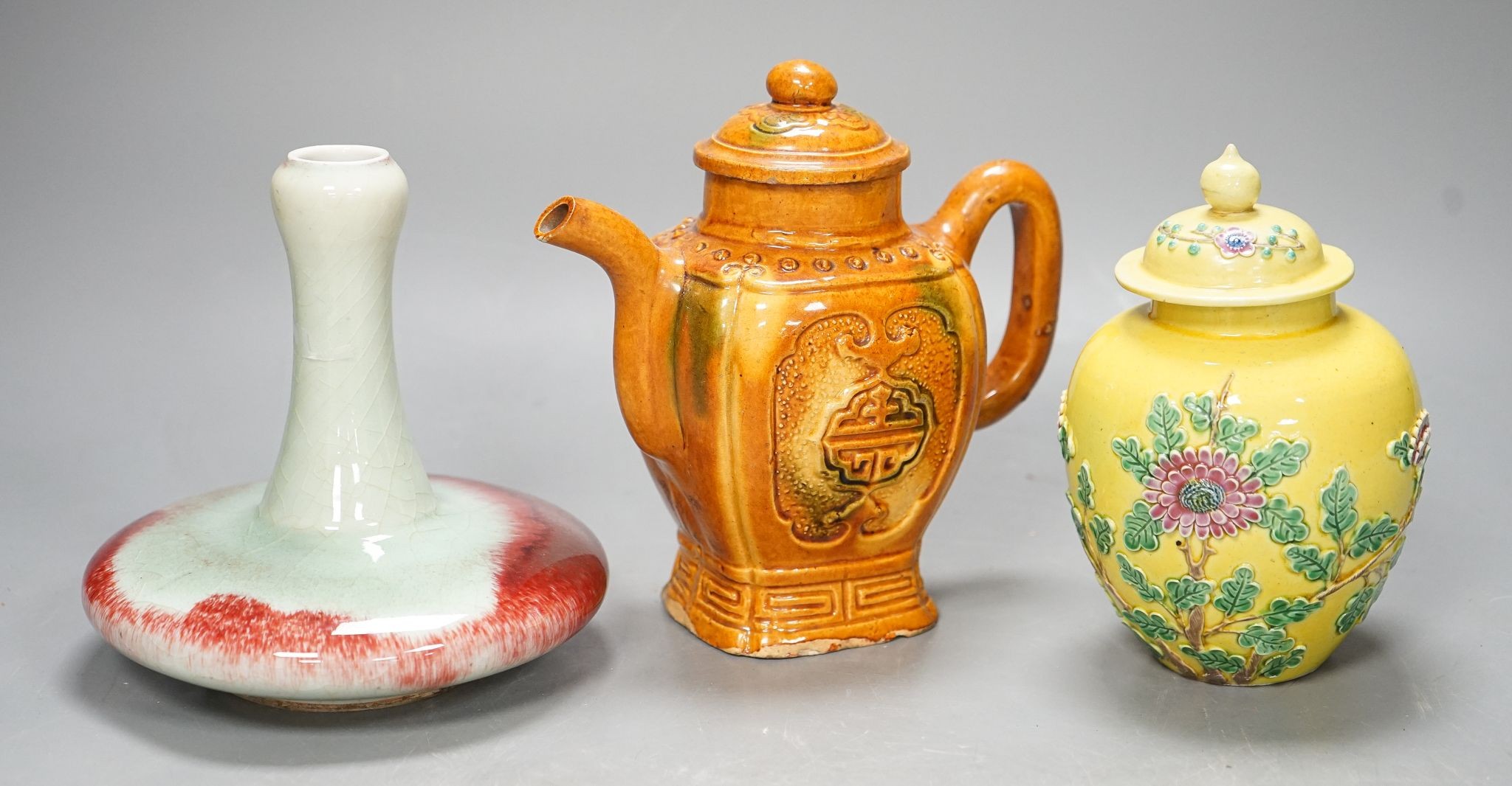 A Chinese enamelled yellow-ground jar and cover, a pottery teapot and cover and a flambe vase, latter 13cm
